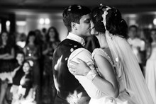 Bride And Groom Kiss Each Other Tender After Their First Dance