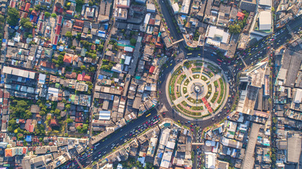 Wall Mural - Aerial view, Road roundabout, Expressway with car lots in the city in Thailand.  beautiful Street , downtown, cityscape, Top view. Background