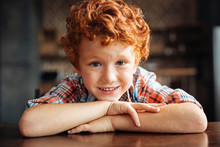 Adorable Redhead Boy Smiling Into Camera