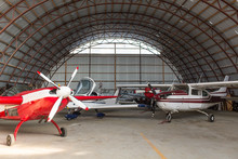 Interior View Of Airplanes Parked In Hangar