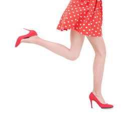 Wall Mural - Young woman wearing dress and high heels on white background