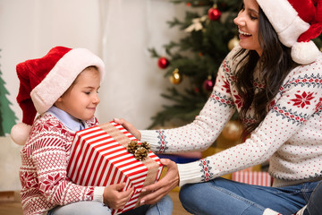 Wall Mural - mother and daughter with christmas gift