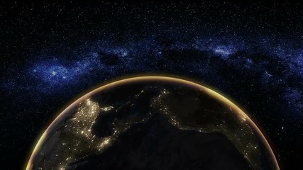 Wall Mural - sunrise view from space on planet earth. world rotating on its axis in black universe in stars. glob