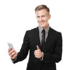 Wall Mural - Young businessman with phone on white background