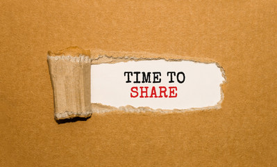 Poster - the text time to share appearing behind torn brown paper