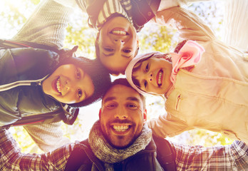 Canvas Print - happy family hugging outdoors