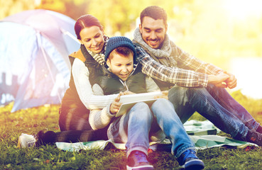 Sticker - happy family with tablet pc and tent at camp site