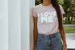 Girl is wearing t-shirt with a text 
