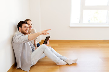 Sticker - happy couple with tablet pc computer at new home