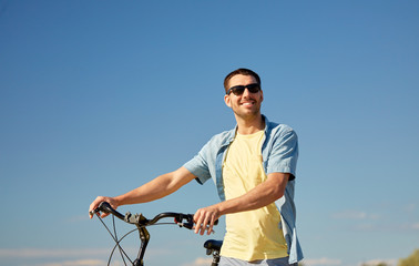 Wall Mural - happy smiling man with bicycle outdoors