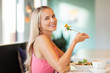 © Syda Productions - happy young woman eating lunch at restaurant