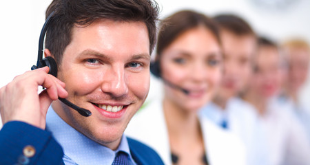 Wall Mural - Attractive positive young businesspeople and colleagues in a call center office