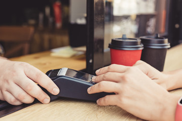 Poster - Person using pos terminal at the outdoor cafe