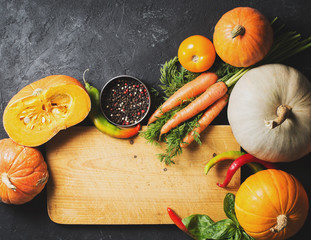 Wall Mural - Group of vegetables over black texture