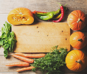 Wall Mural - Group of vegetables over wooden texture