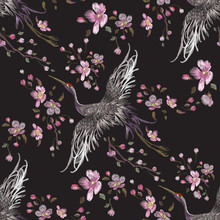 Embroidery oriental seamless pattern with cranes and cherry blossom. Vector embroidered floral patch with bird for clothing design.