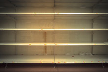 Empty Shelves In Store In Humble, Texas USA. Supermarket With Empty Shelves For Goods. Vintage Tone.