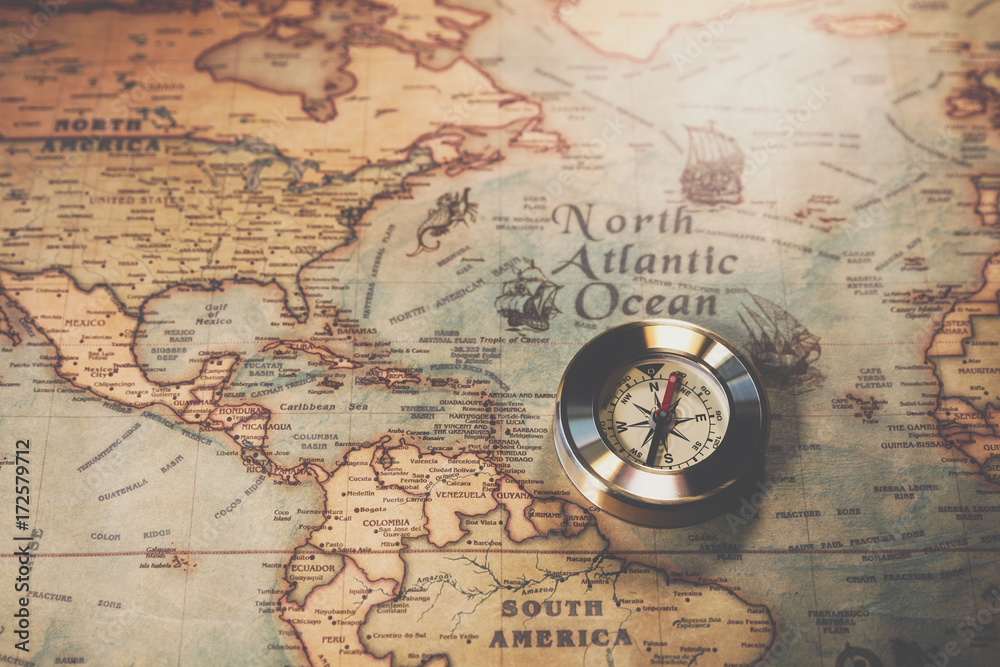Columbus day and world map with compass. The map used for background is ...