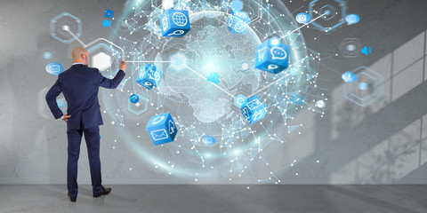 Poster - Businessman using digital planet earth interface on a wall 3D rendering