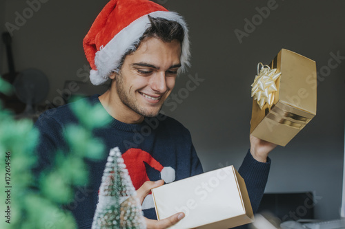 Fotografie, Obraz young at the office or studying with the christmas gift