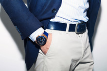 Closeup Fashion Image Of Luxury Watch On Wrist Of Man.body Detail Of A Business Man.Man's Hand In A White Shirt,blue Jacket  In A Pants Pocket Closeup. Tonal Correction.Man Posing In Blue Suit.