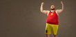 © Studio Romantic - A fat man in sports clothes screams happy at the victory.