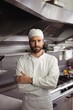 © wavebreak3 - Portrait of confident chef standing with arms crossed in