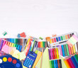 Colorful stationery supplies donations, top view with copy space