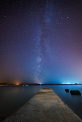 Wall Mural - Night scene with stone pier and starry sky