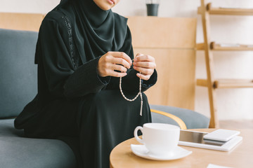 Poster - muslim woman with prayer beads