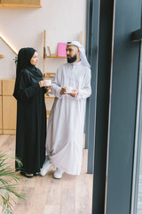 Wall Mural - muslim couple drinking coffee