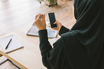 Poster - muslim woman using smartphone