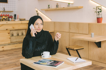 Poster - muslim woman talking by phone