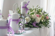 violet wedding decorations - candles and flowers in a background
