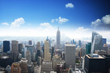 Fototapeta  - Manhattan panorama in summer time with blue sky, Empire State Building in the center of the picture