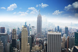 Fototapeta  - Aerial view of Empire State Building, looking over midtown Manhattan, with clear blue sky