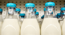 Bottles With Milk As Dairy Product For Preparing Breakfast Wait For Byers On Market Shelf