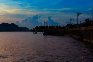 Wall Mural - bright colors at dawn on the beach at sunrise in the gulf of thailand.