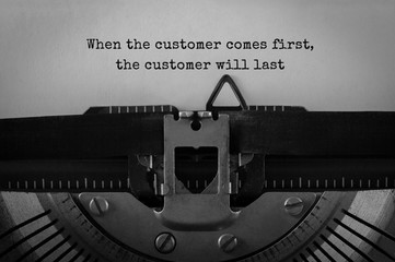Poster - Text When the customer comes first the customer will last typed on retro typewriter