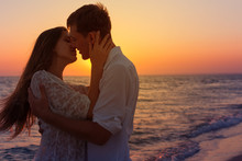 Romantic Couple Kissing On The Beach