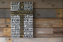 Wooden Carved Word Of The Lord's Prayer On The  Shabby Wooden  Plank  Background.