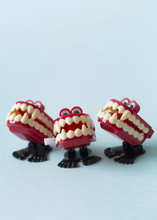 The Singers: Close Up Of Wind Up Vampire Chattering Teeth Toys