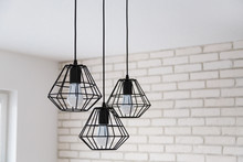 A Modern Loft Chandelier Made Of Black Wire In A Stylish White Interior