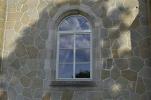 Mysterious Window With Arch, In Old Sandstone Wall