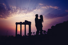 Silhouette Of Lover Backdrop Of Ancient Ruins.