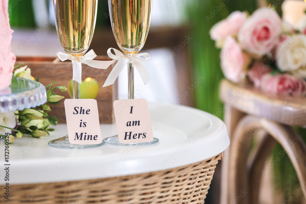Champagne glasses on table indoors. Concept of lesbian wedding