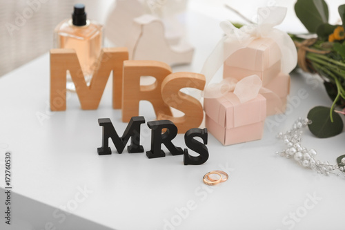 Rings With Decorations For Lesbian Wedding On Table In The Room