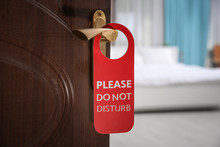 Open Door With Sign PLEASE DO NOT DISTURB On Handle At Hotel