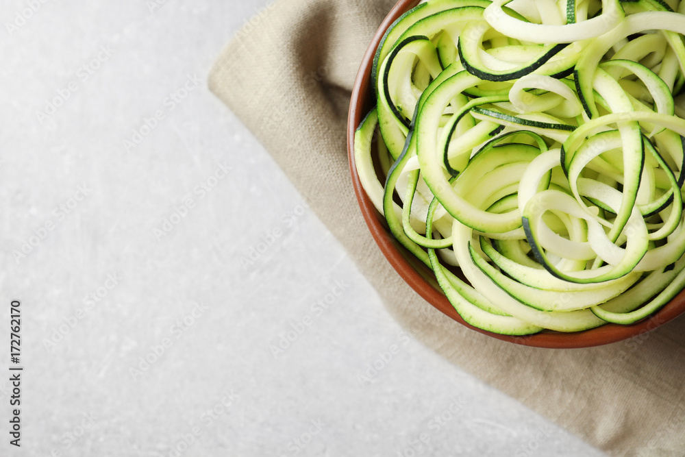 Spaghetti squash in bowl on grey background
