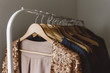 © Carey Shaw/Stocksy - Sequin pink jacket hanging on clothing rack